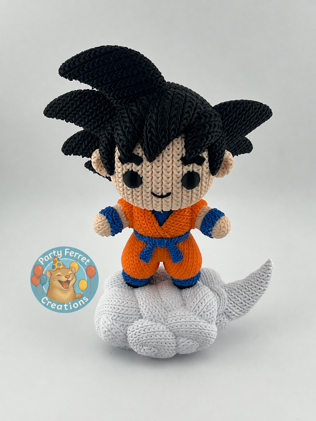 Crochet-style 3D-printed Goku on Nimbus with Party Ferret Creations watermark
