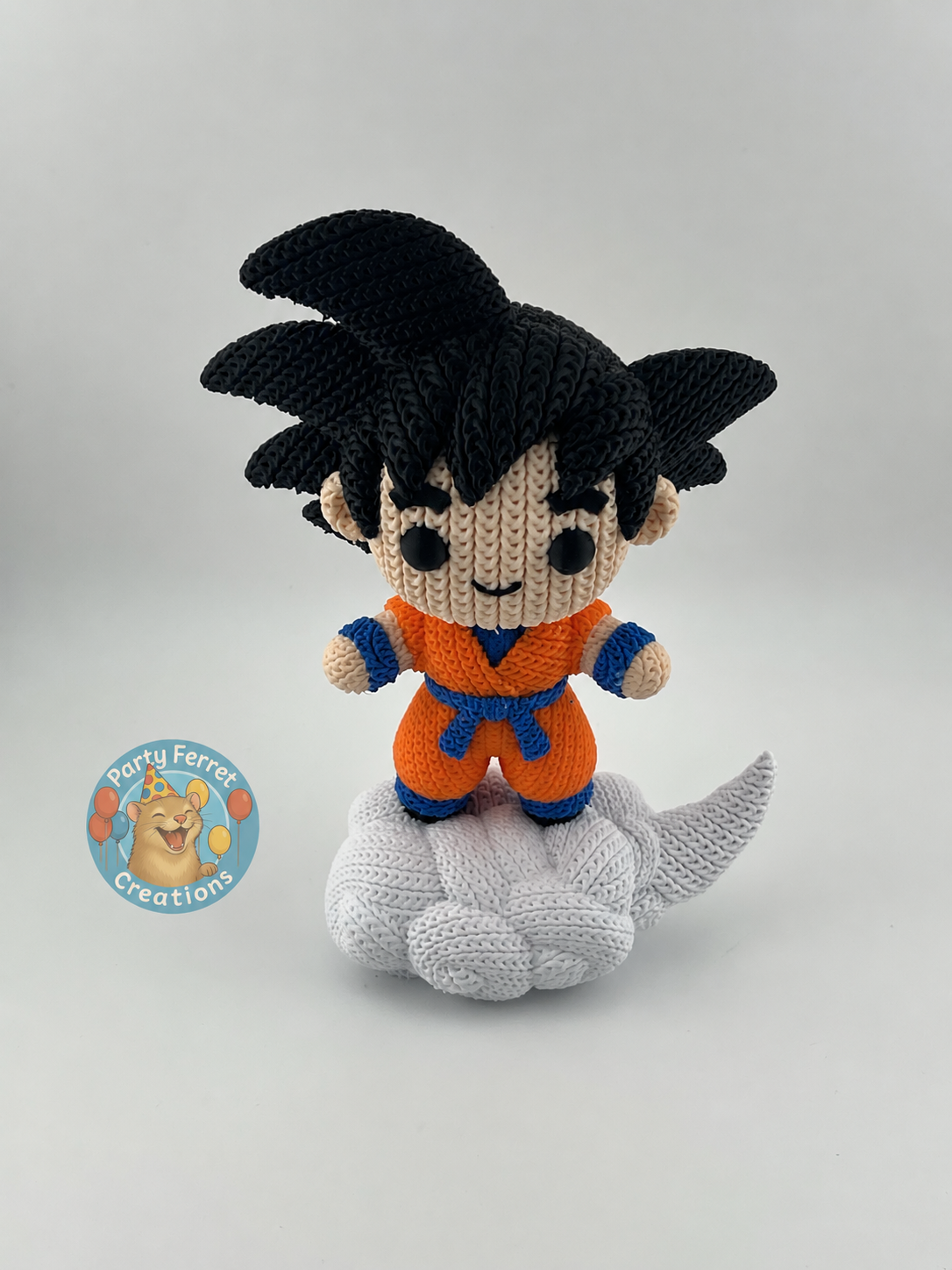 Crochet-style 3D-printed Goku on Nimbus with Party Ferret Creations watermark