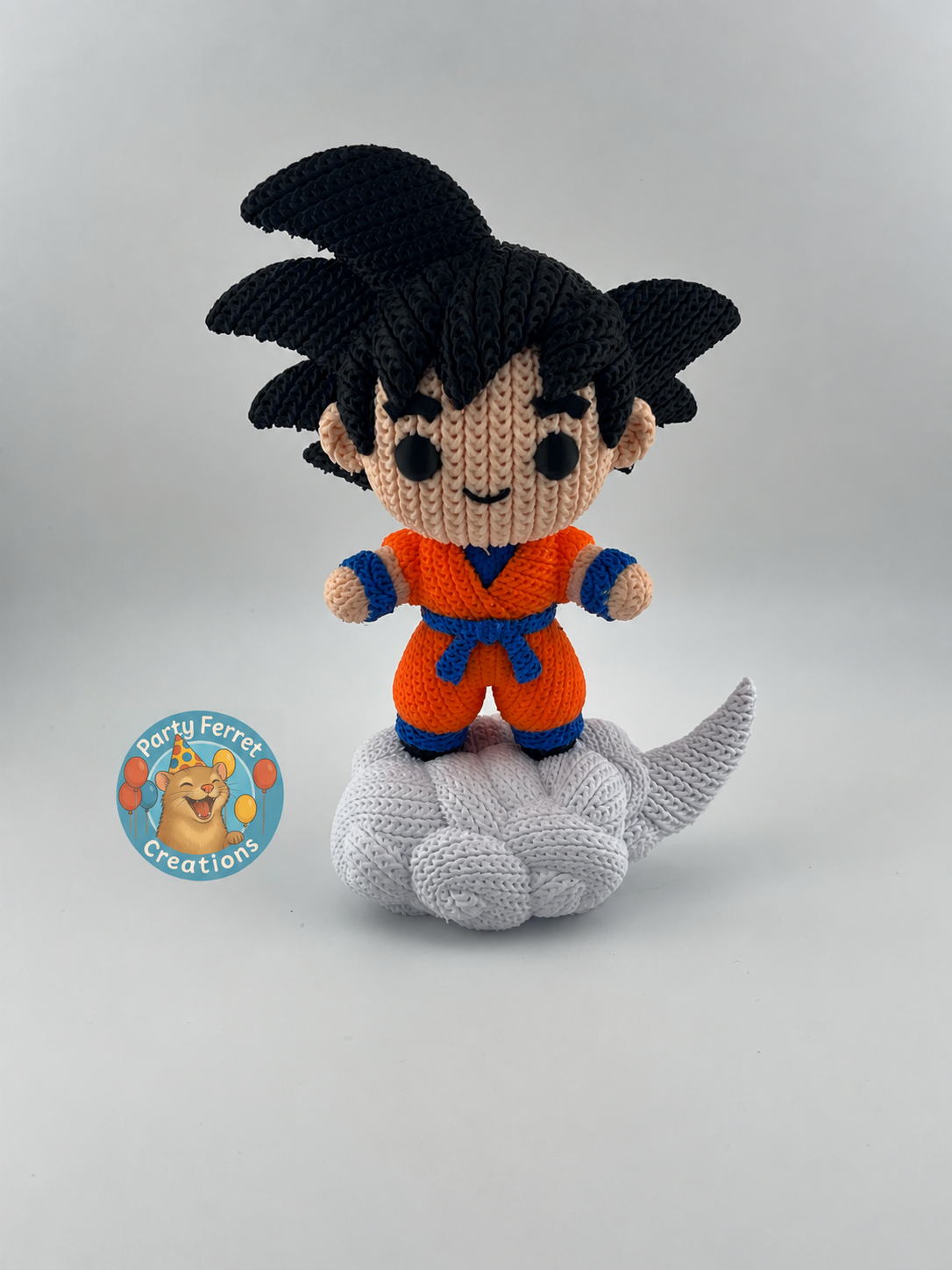 Crochet-style 3D-printed Goku on Nimbus with Party Ferret Creations watermark