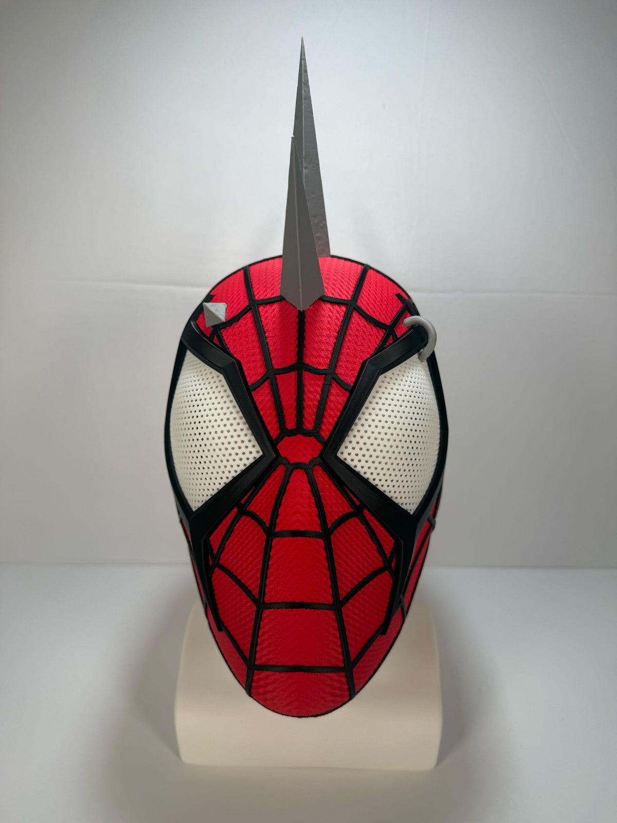 3D printed Spider-Punk helmet, front view. Spikes shown assembled; shipped unattached.