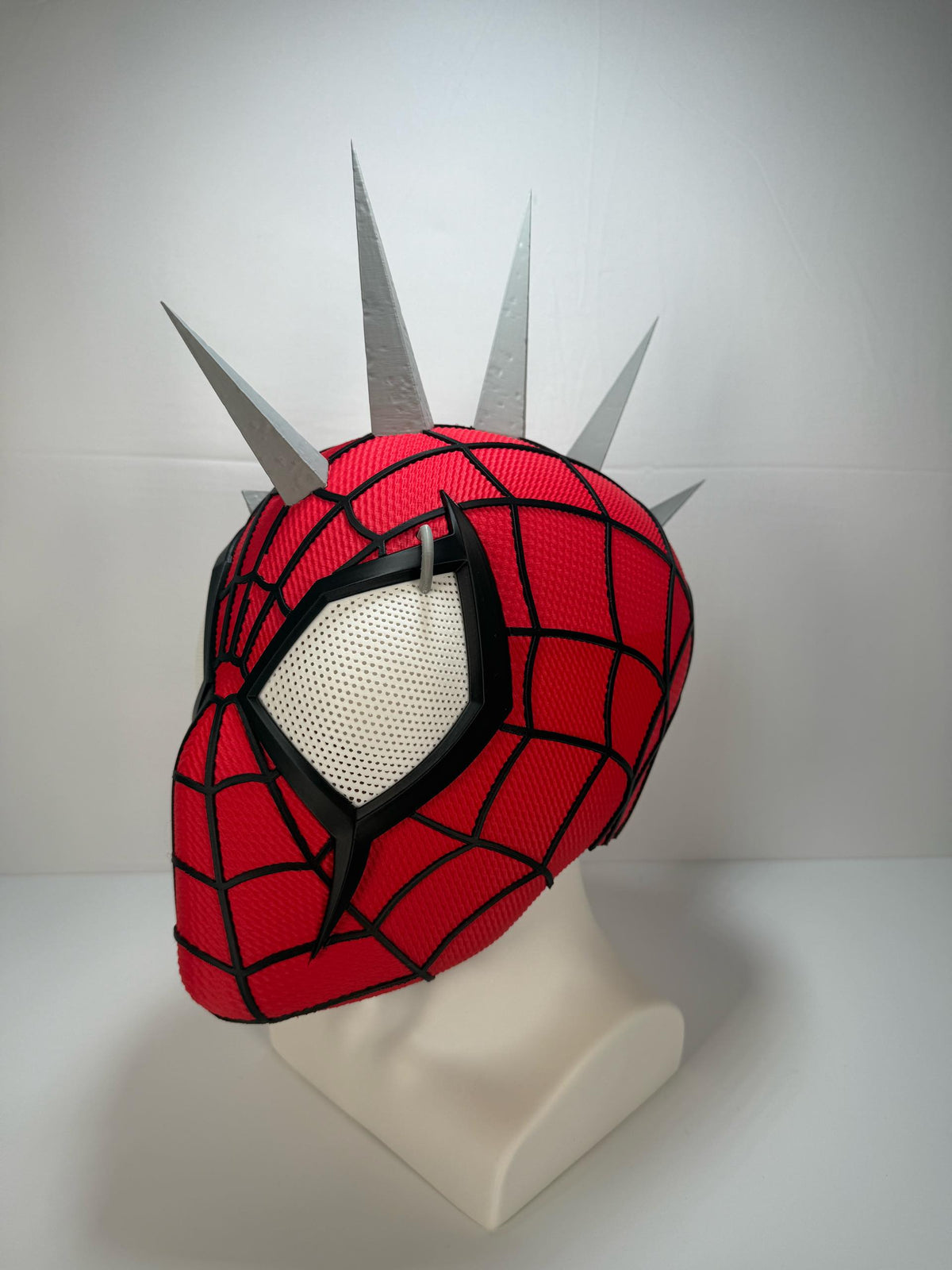 3D printed Spider-Punk helmet, three-quarter view. Spikes shown assembled; shipped unattached.